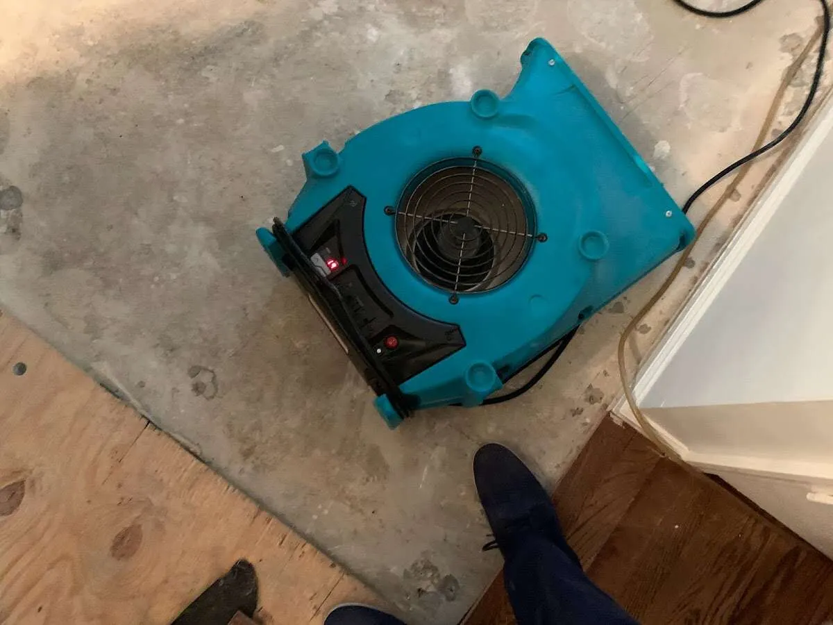 Air mover drying subfloor during Leak Detection & Repair in Souderton